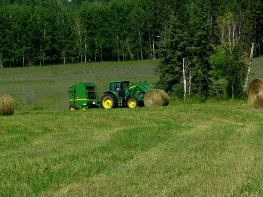 What size net wrap fits a John Deere 535 baler — John Deere 7420 tractor pulling a John Deere 567 MegaWide round baler in Alberta, Canada
