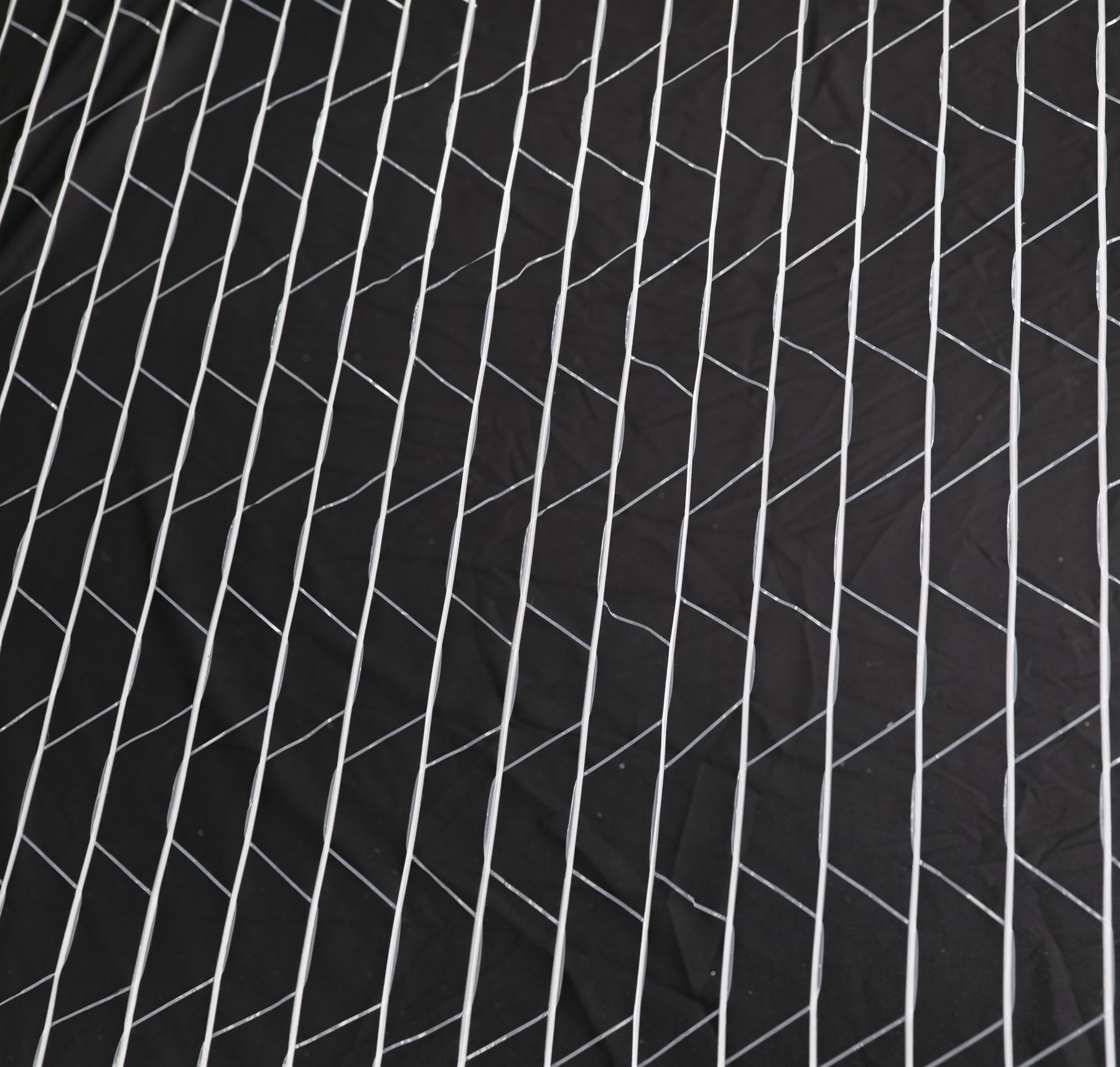 DualBond net wrap structure — two wide HDPE strands thermally bonded at every cross point