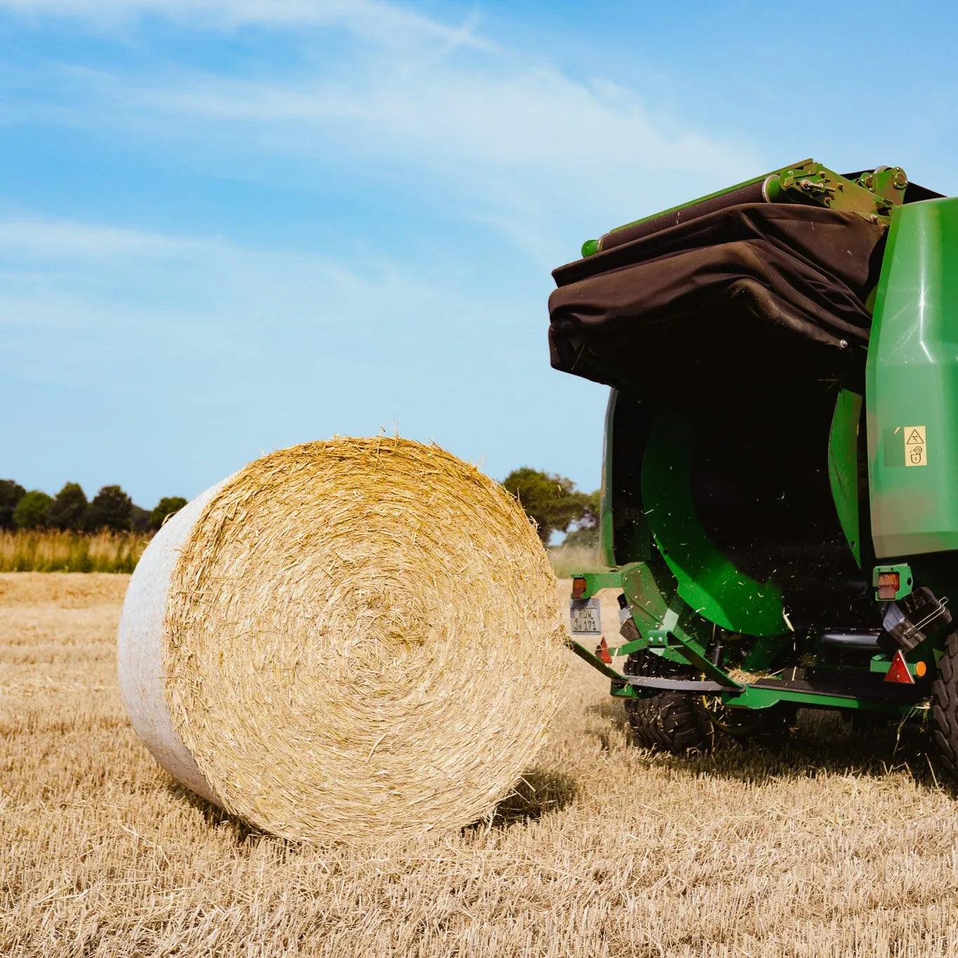 a net warp bale was just produced from the green JD baler